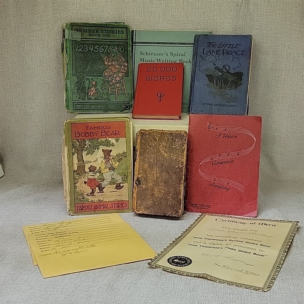 7 vintage school books and report cards‎